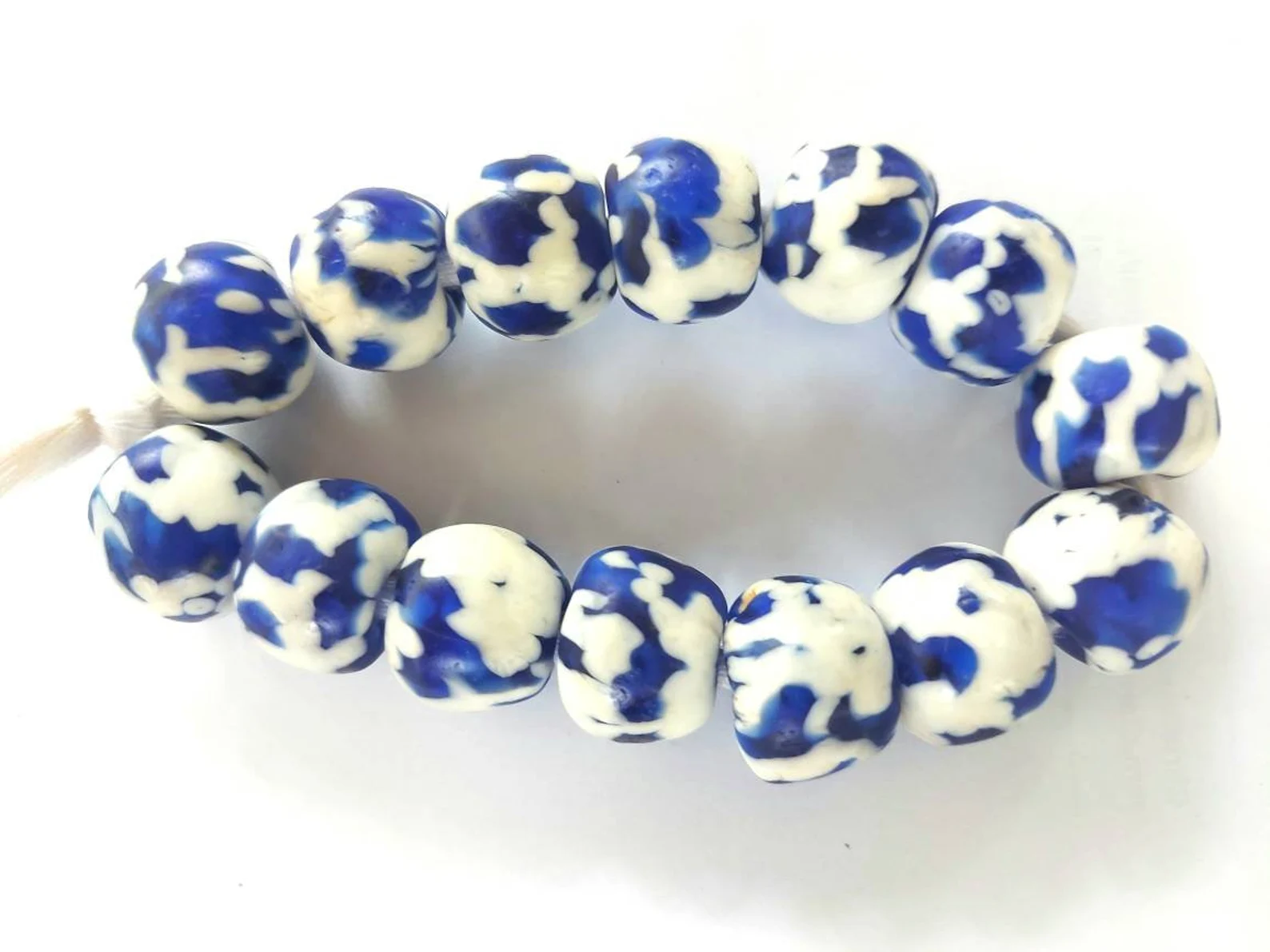 14 melted glass beads 14 melted glass beads