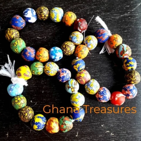 13 fused glass beads, 18 mm.diam., mixed strand