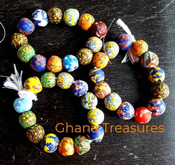 13 fused glass beads, 18 mm.diam., mixed strand