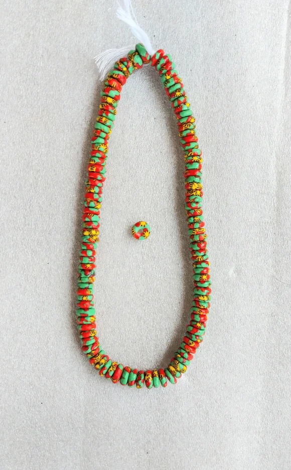 100+ African melted glass spacers, rondelle beads, 10-11 mm.diameter